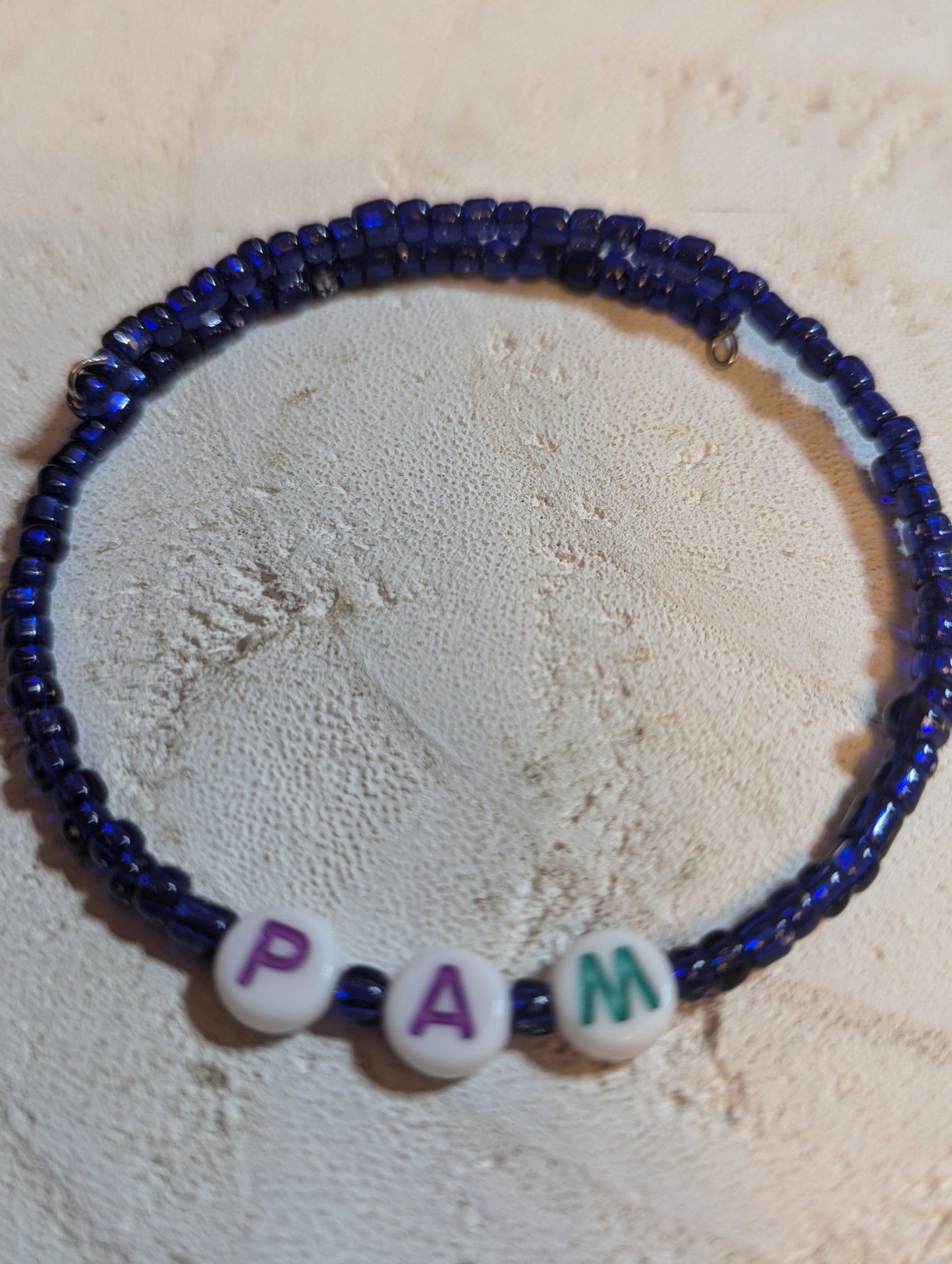 Dark blue beaded bracelet with letter beads. Can add any letters you prefer.