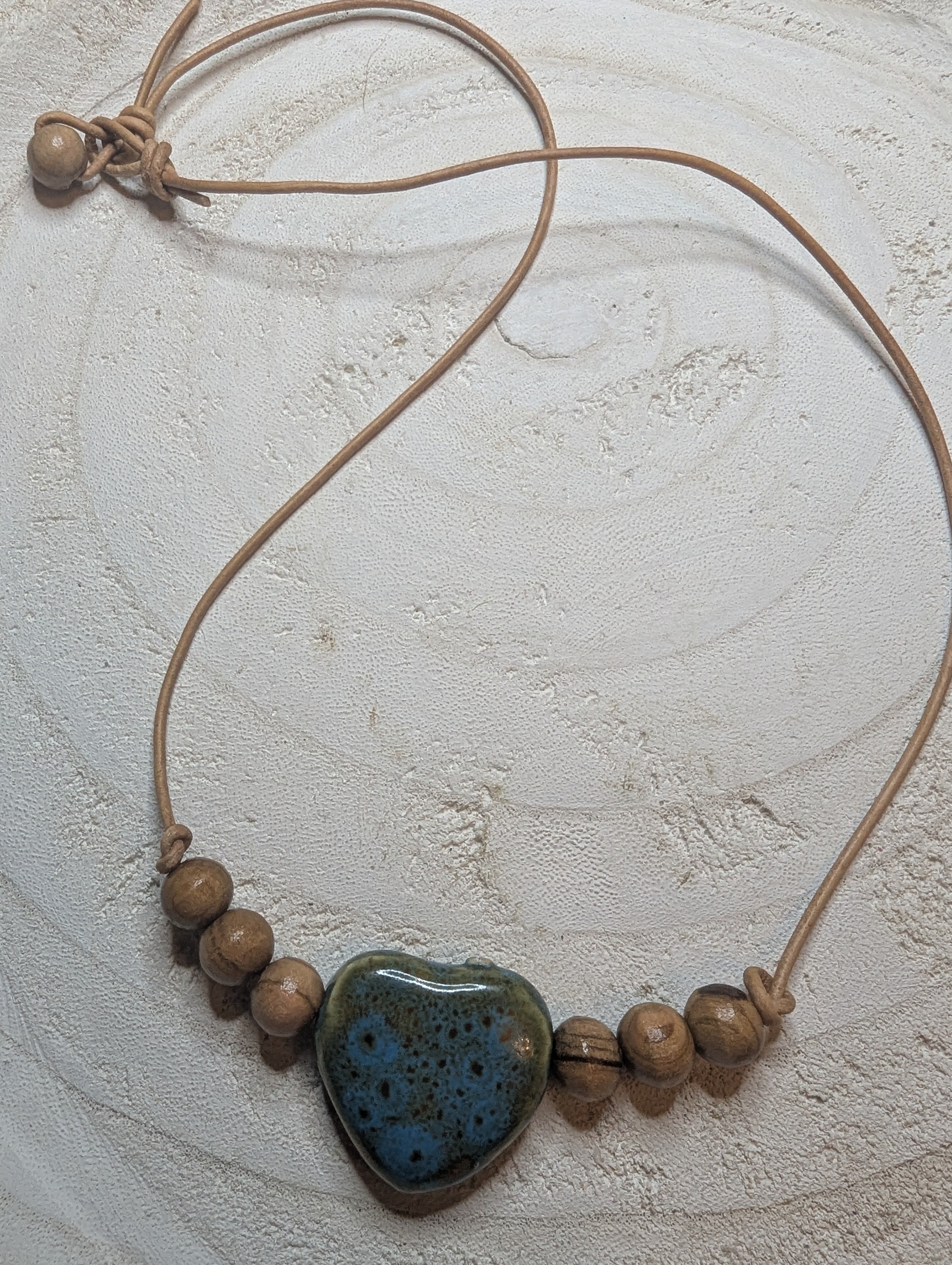 Necklace with heart-shaped blue stone pendant that came straight from the Sedona mountains and wooden beads $20