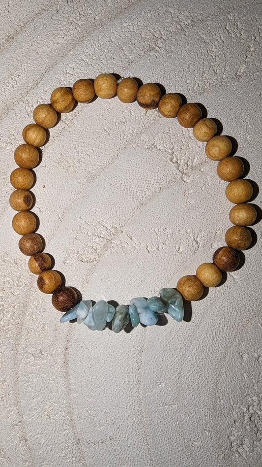Semi precious larimar surrounded by wooden beads