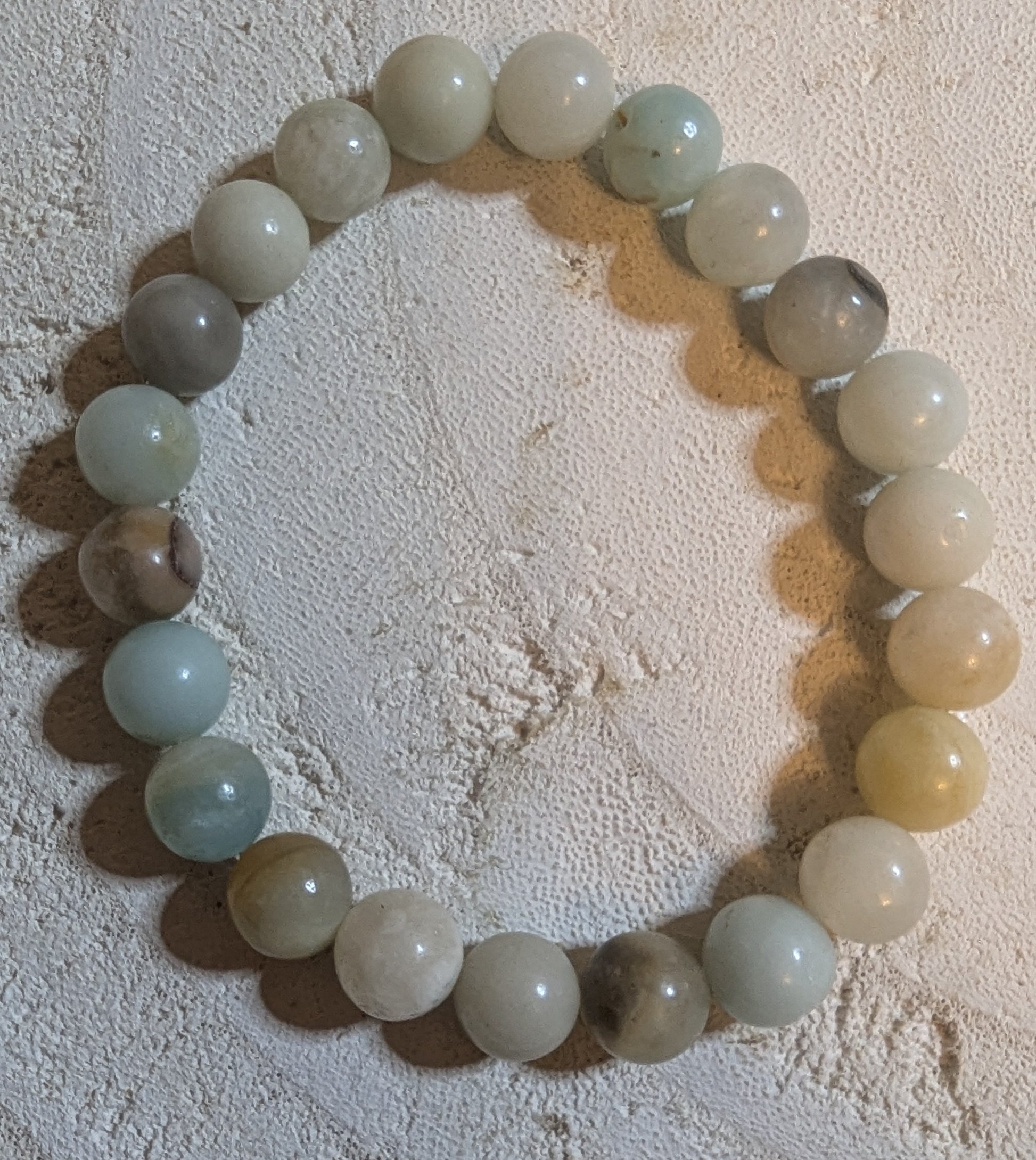 Roundel of light-colored beads