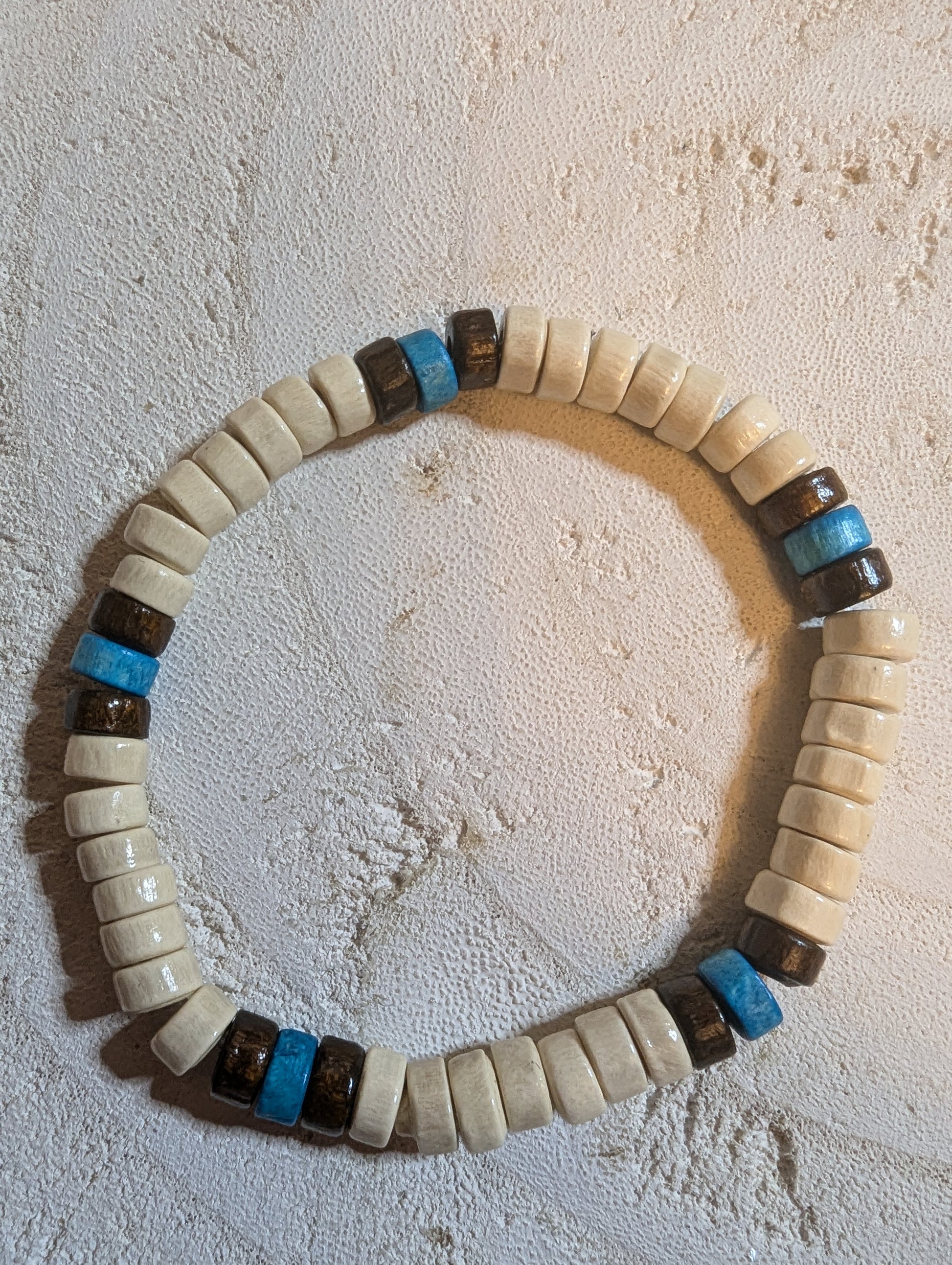 Beaded bracelet with white, brown, and blue beads 
