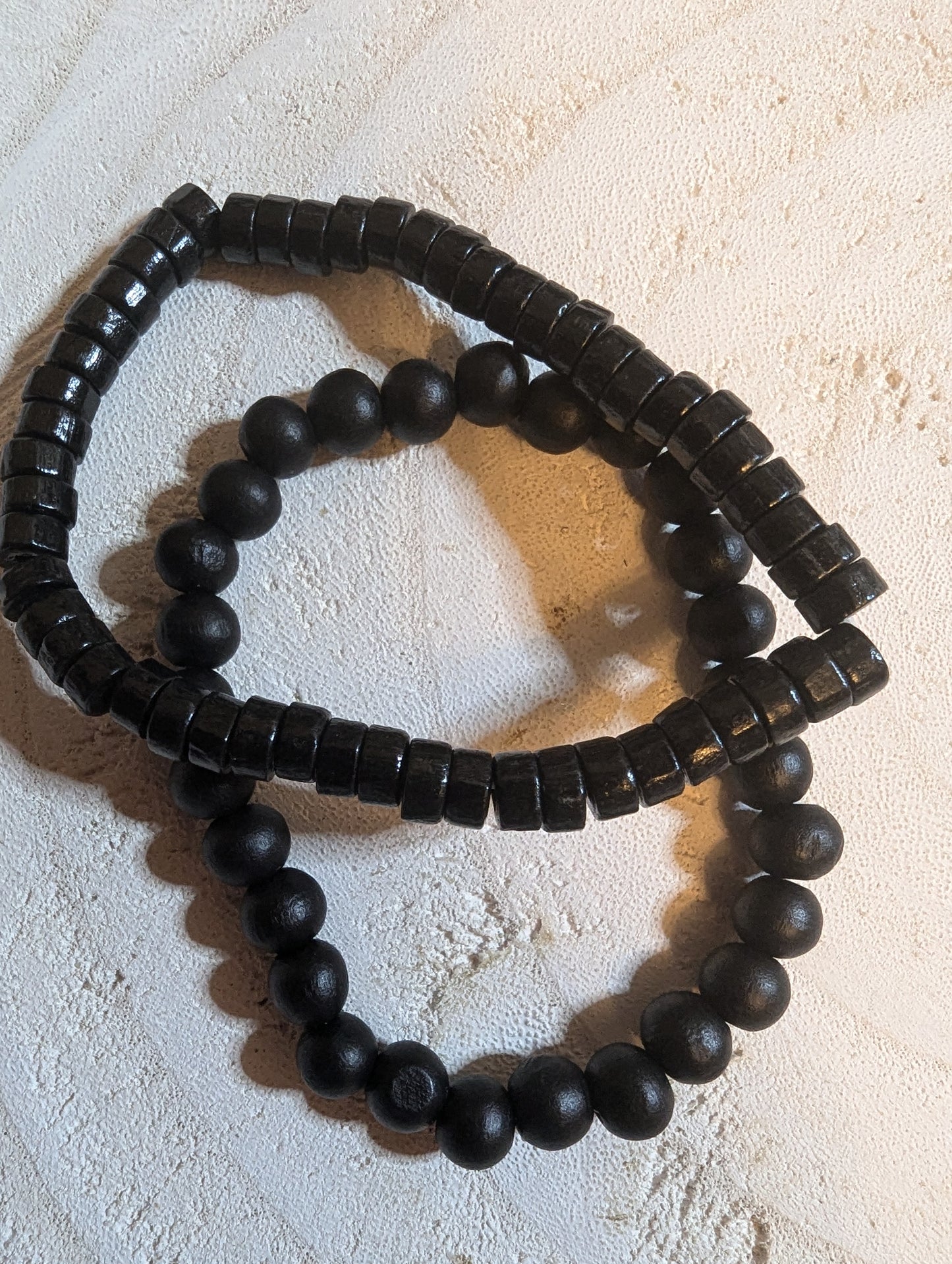 Two black beaded bracelets 