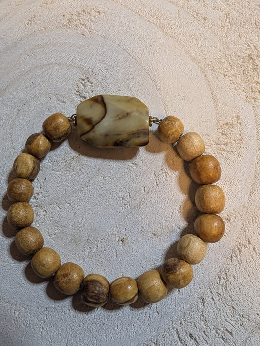 Wooden beaded stretch bracelet with beautiful glass pendant