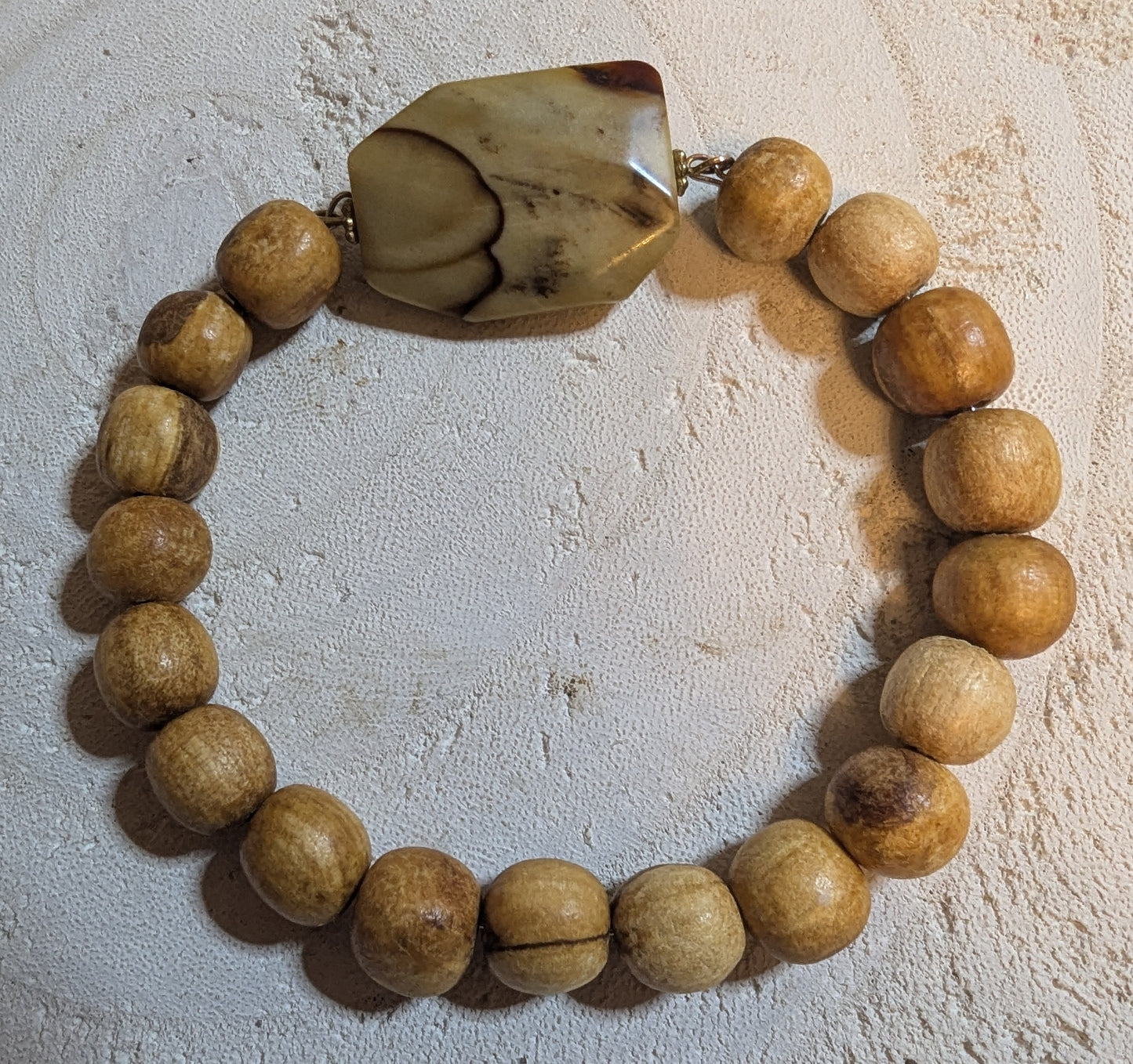 Bracelet with wooden beads and a large stone bead