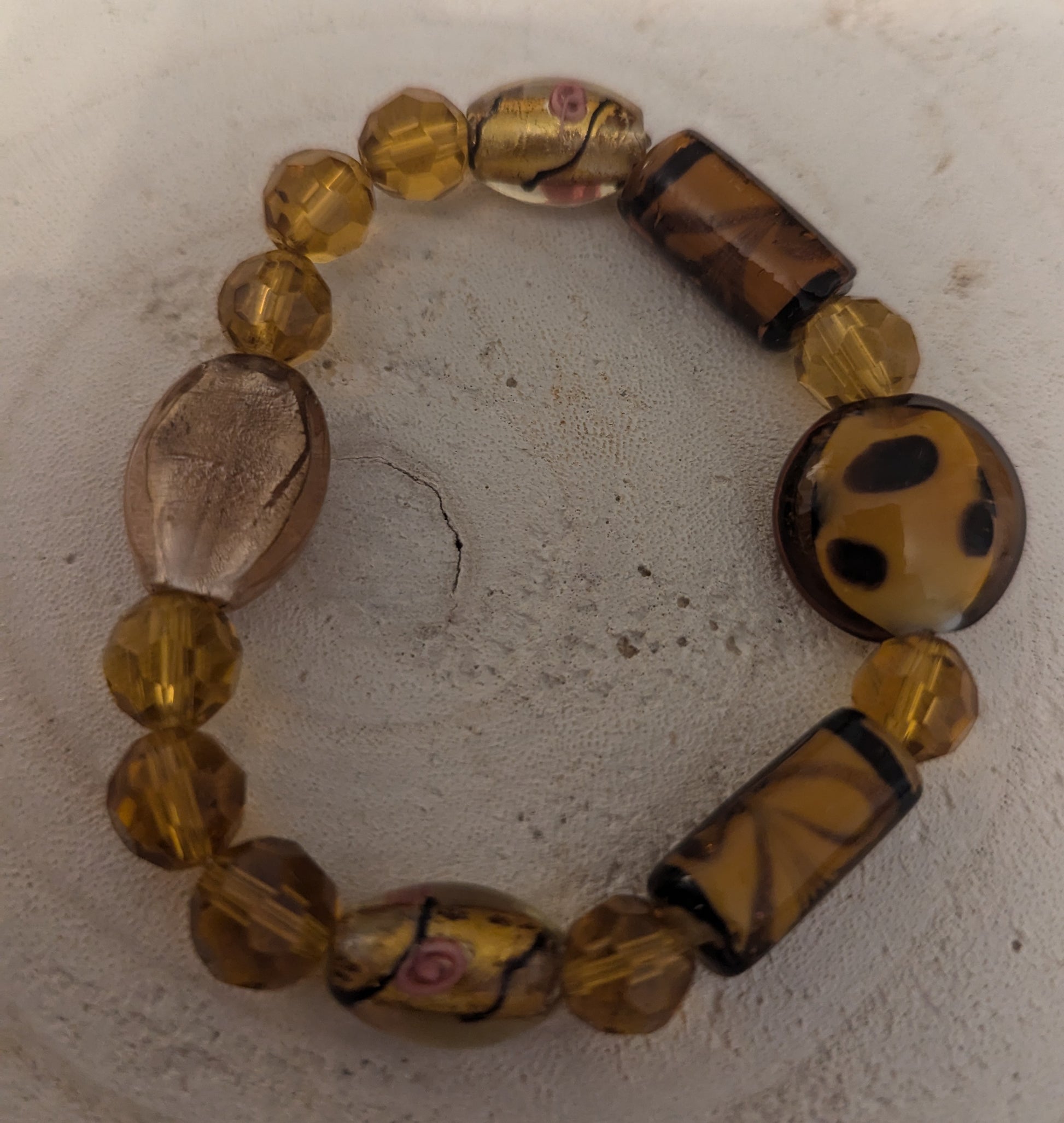 Beaded bracelet with brown and gold beads