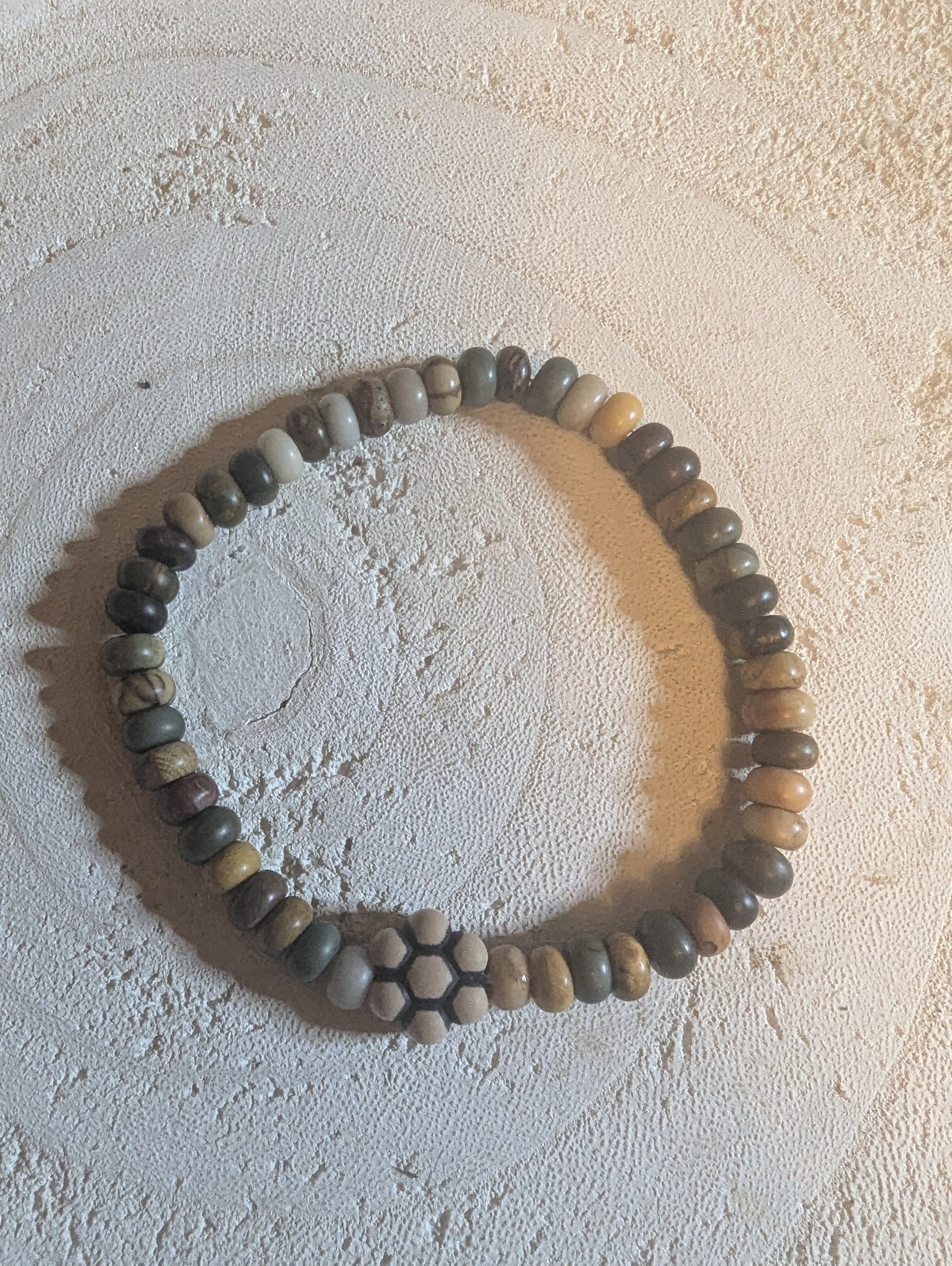 Multicolored round stone  bracelet  with wooden flower charm