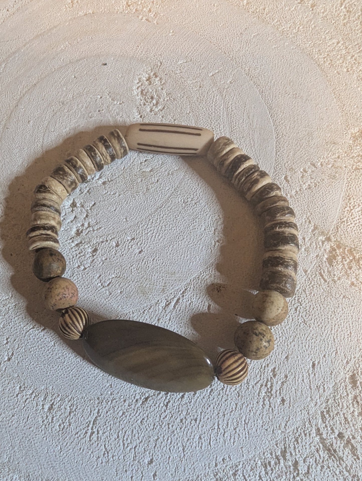 Wooden bracelet with beads with stone pendant