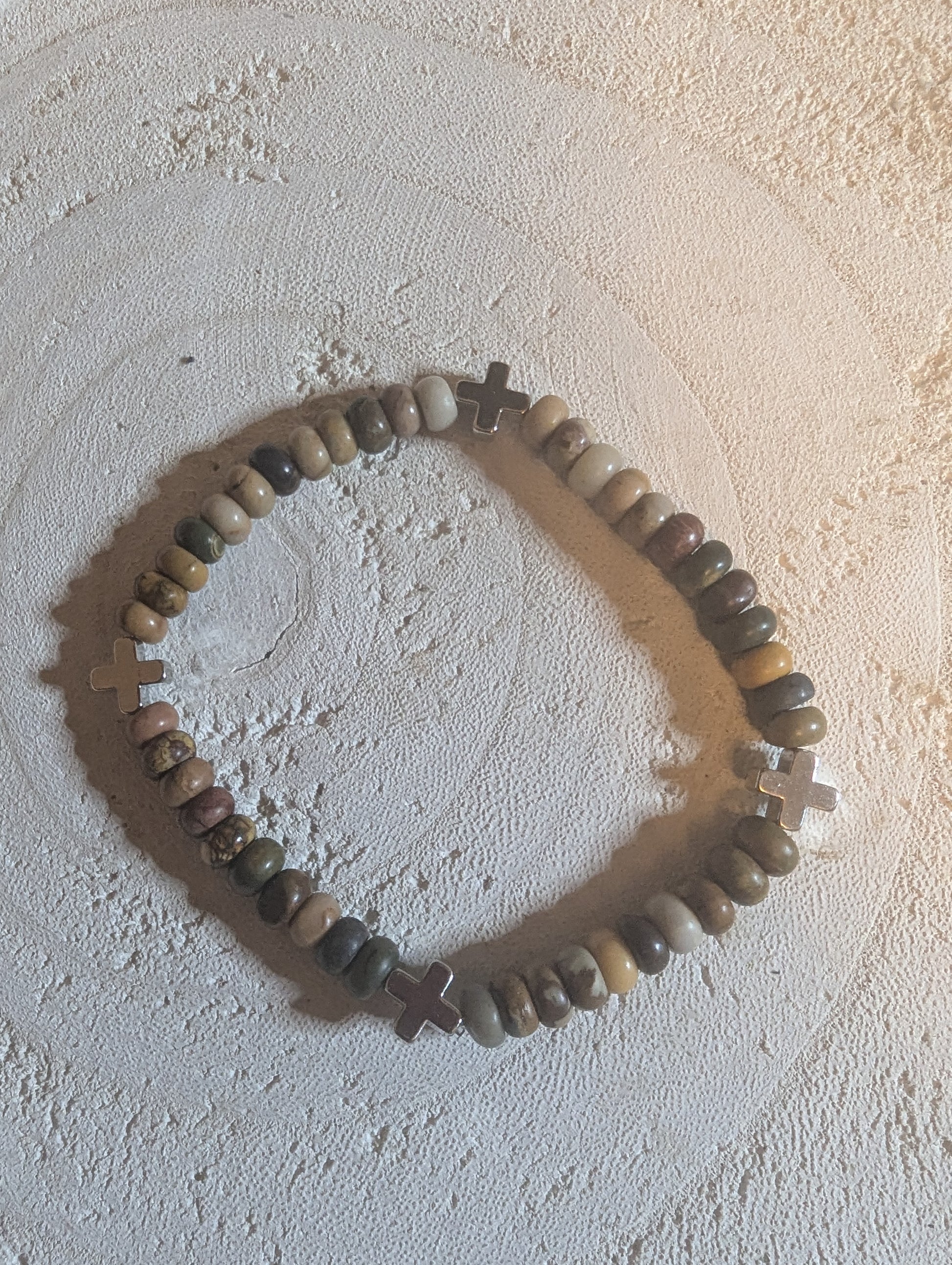 Multi colored beaded bracelet with  silver crosses