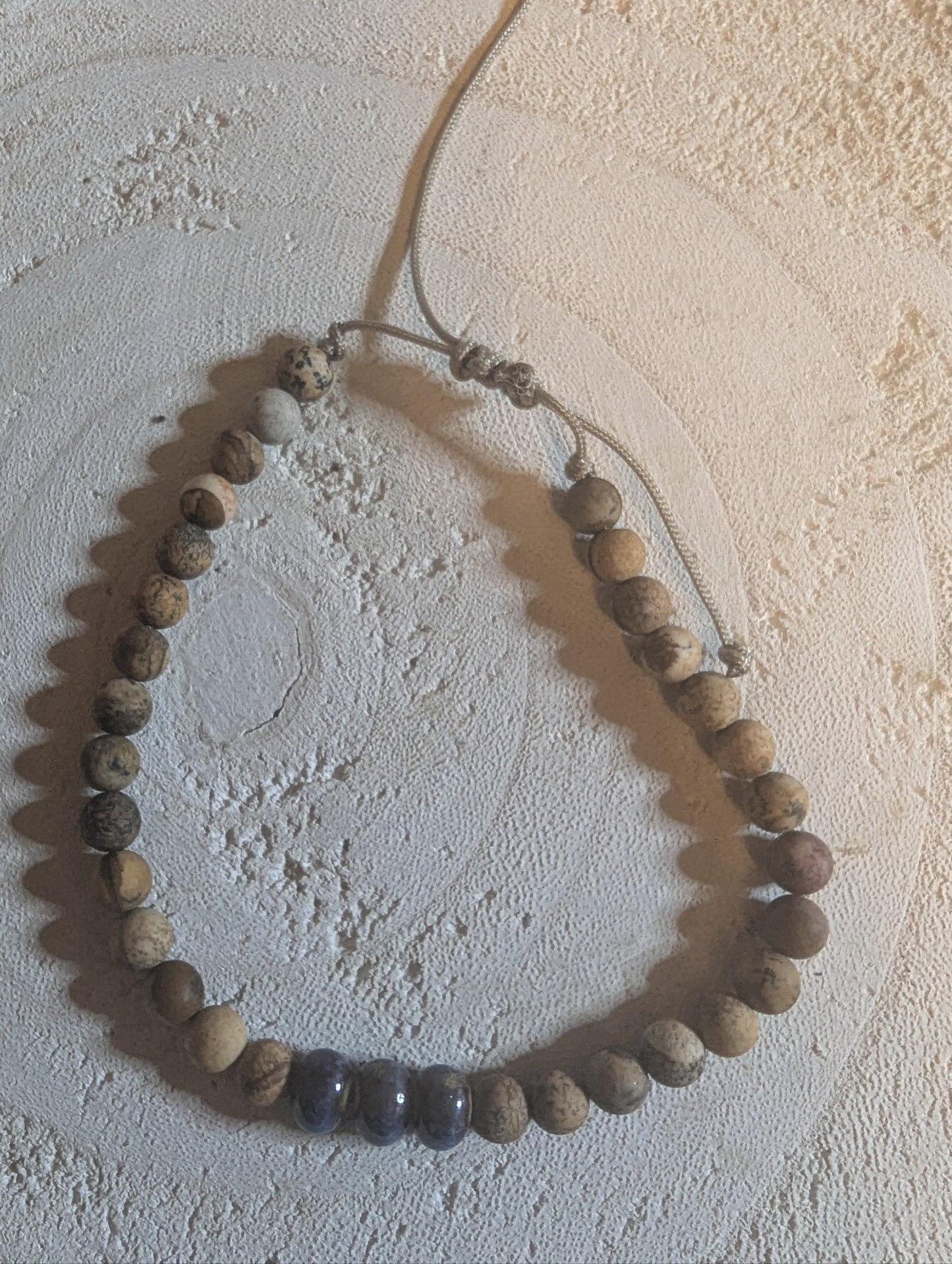 Bracelet with round wooden and glass beads