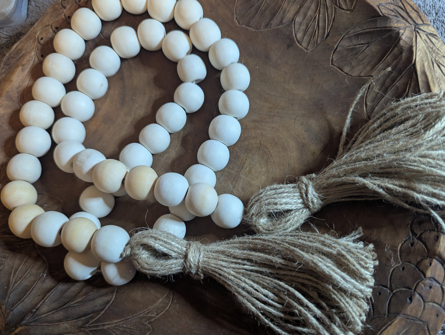 White beaded decoration with tassel 