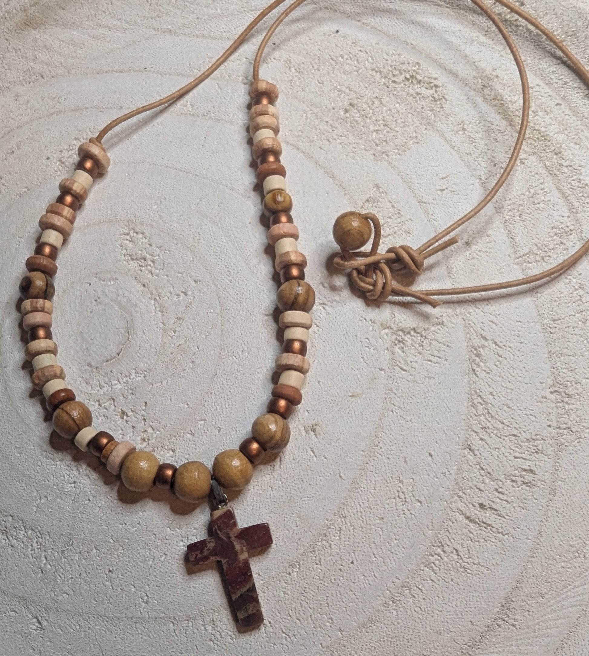 Necklace with wooden beads and a cross pendant 