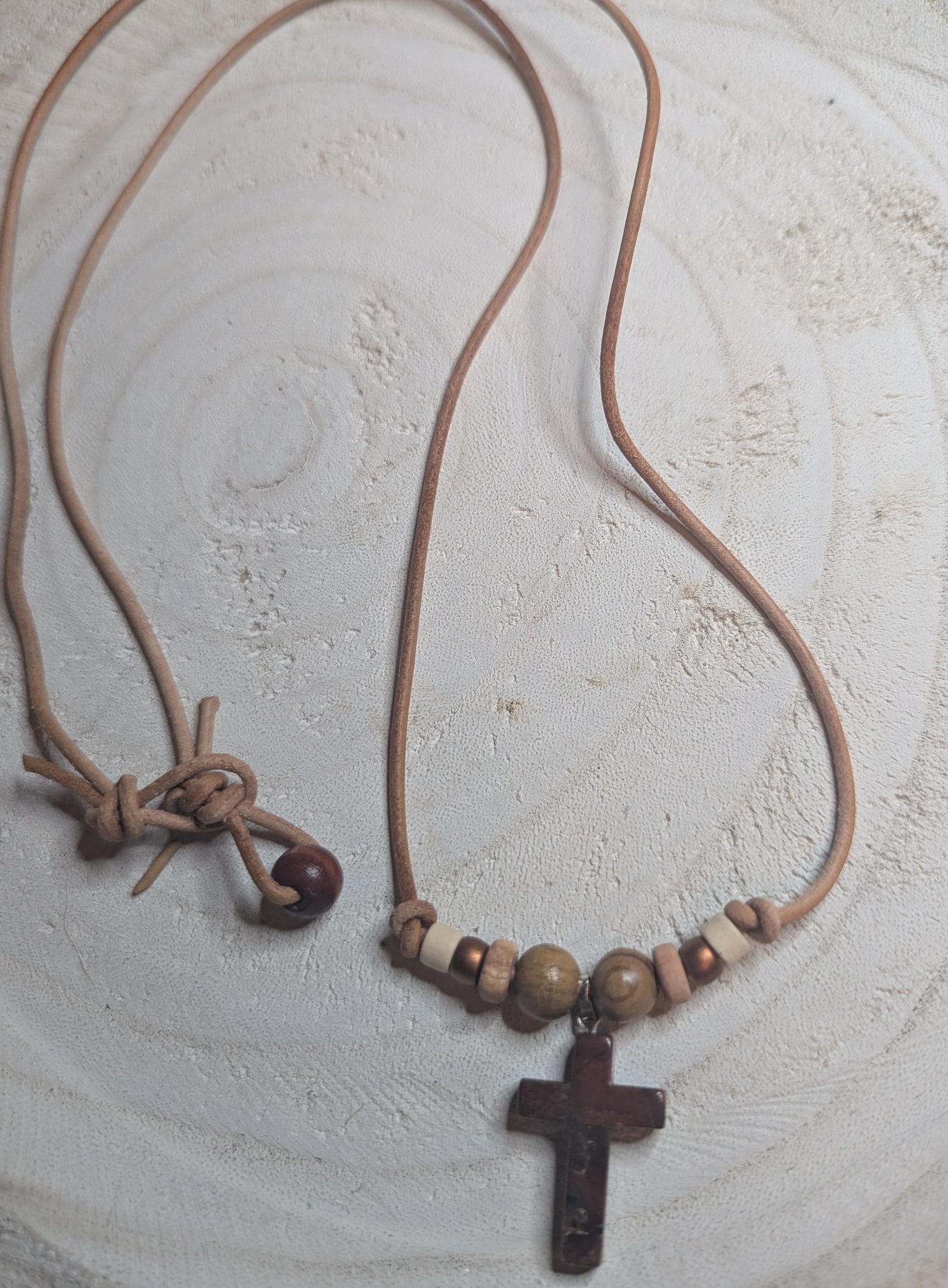 Necklace with a cross pendant and wooden beads 