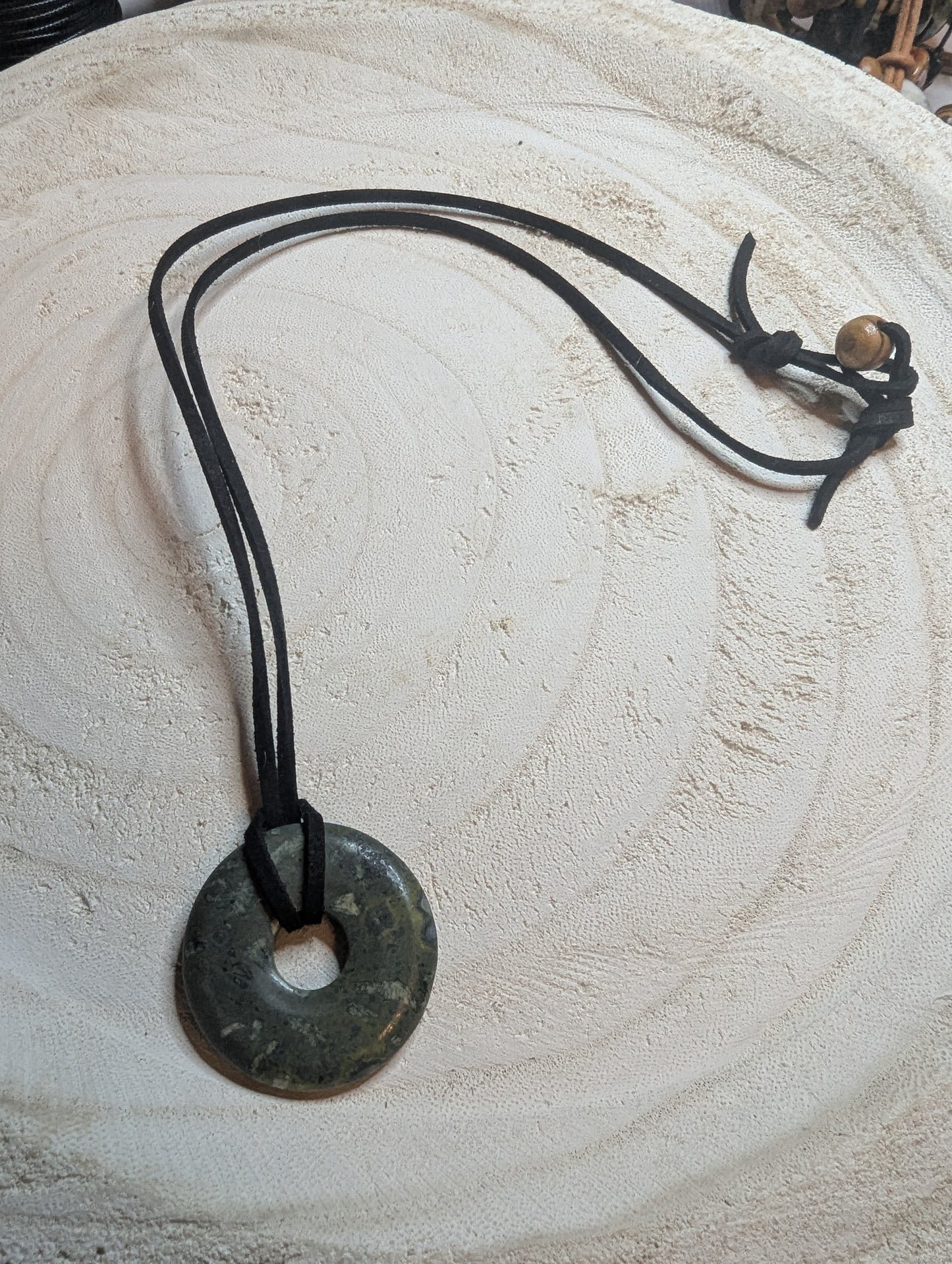 Necklace with a round stone pendant 