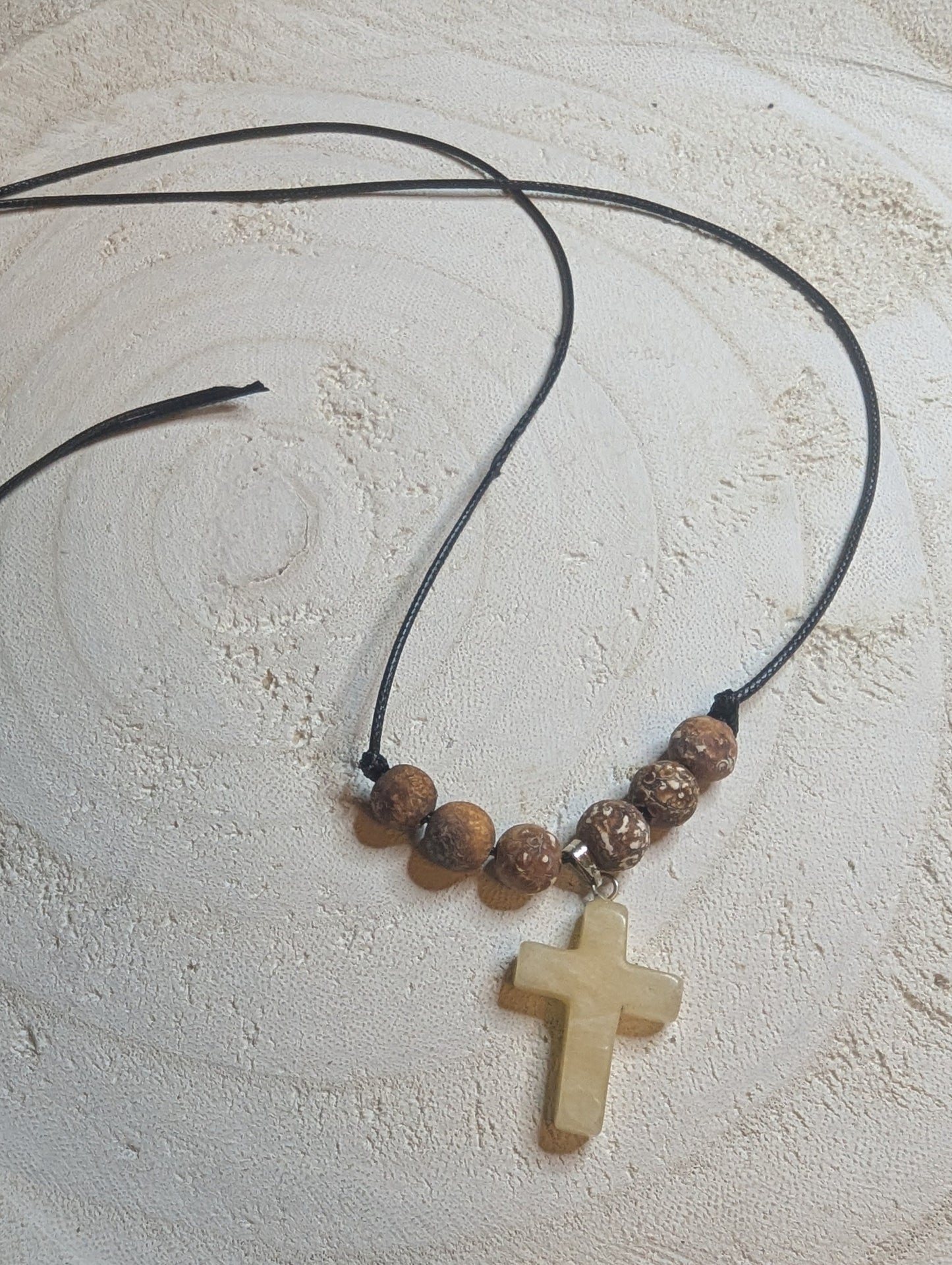 Adjustable necklace with beads and a cross pendant