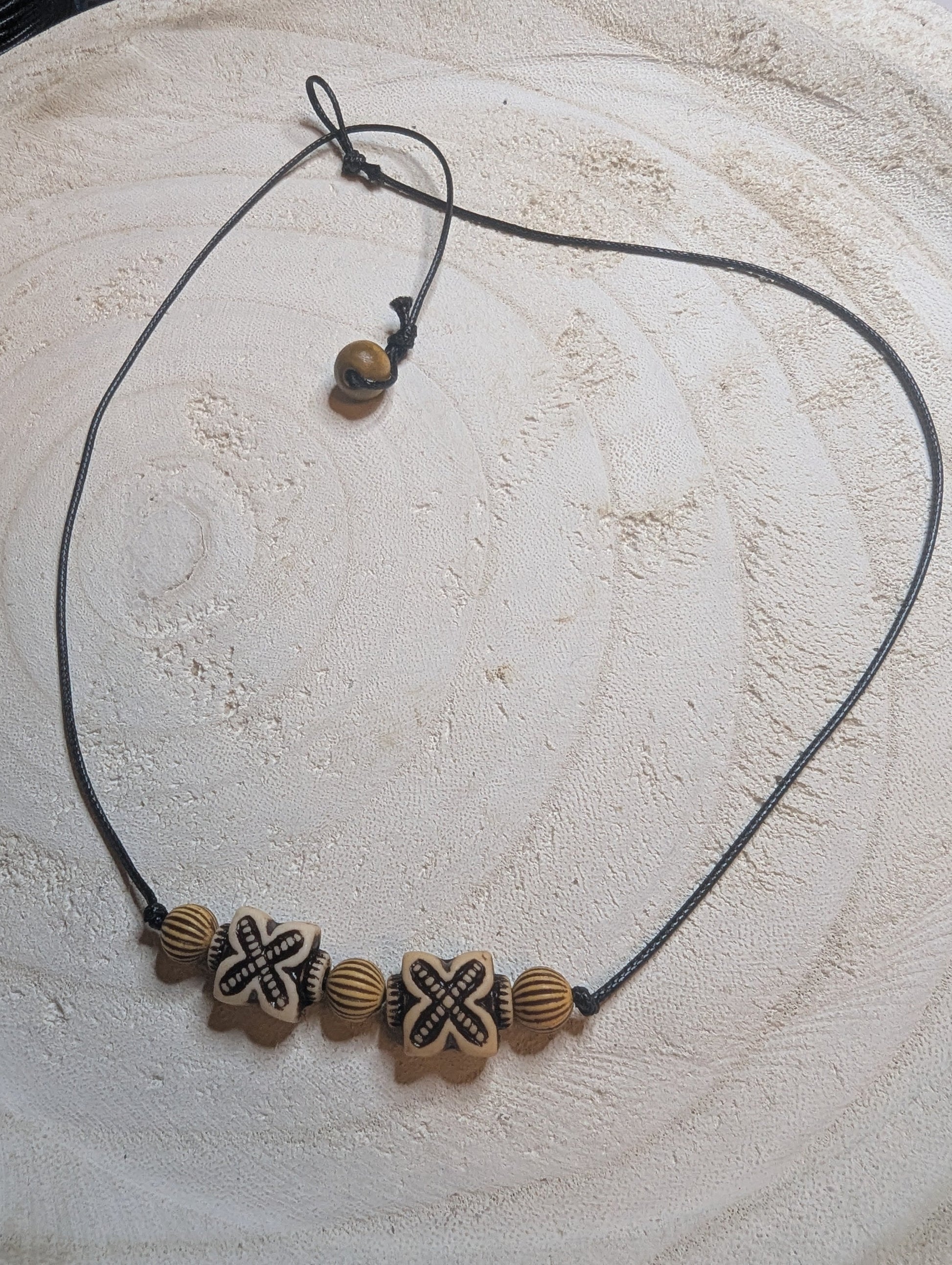 Necklace with wooden beads  on a leather cord