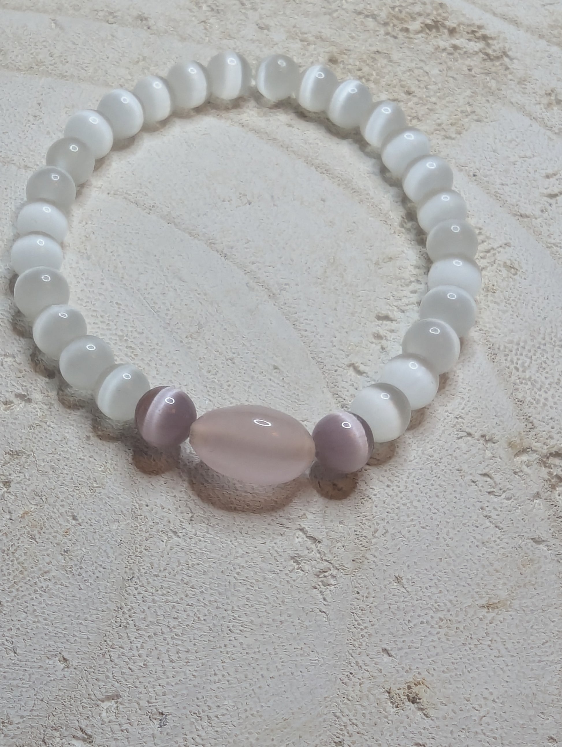 Beaded bracelet with a large pink stone