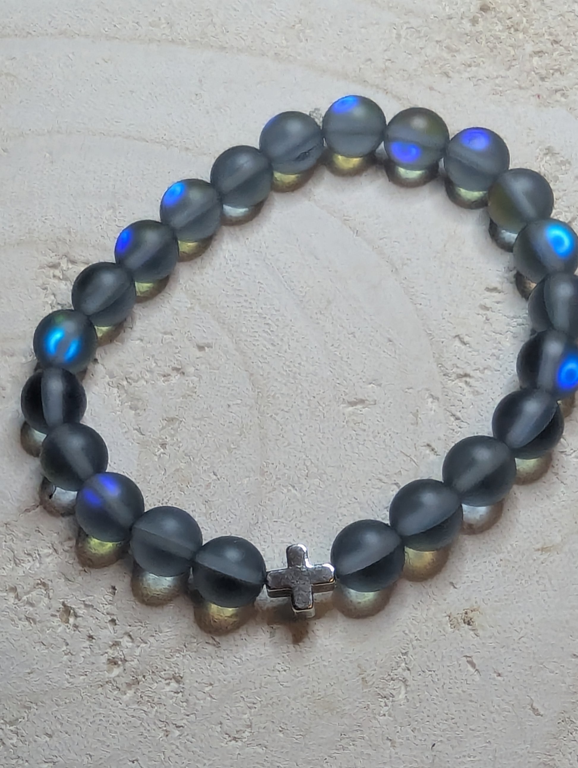 Black beaded bracelet with blue glowing stones
