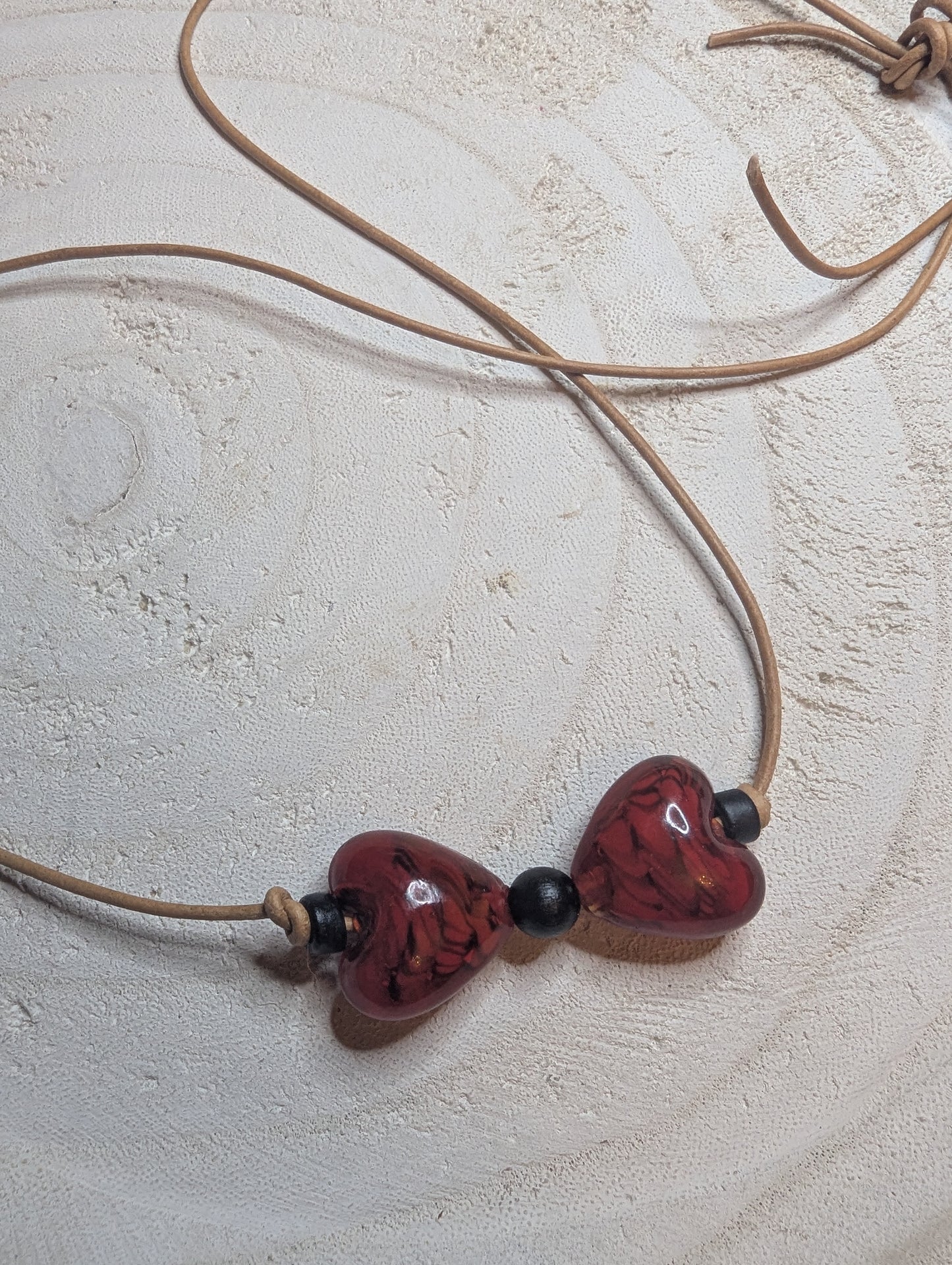 Necklace with heart-shaped beads  from Sedona, AZ on a leather cord.