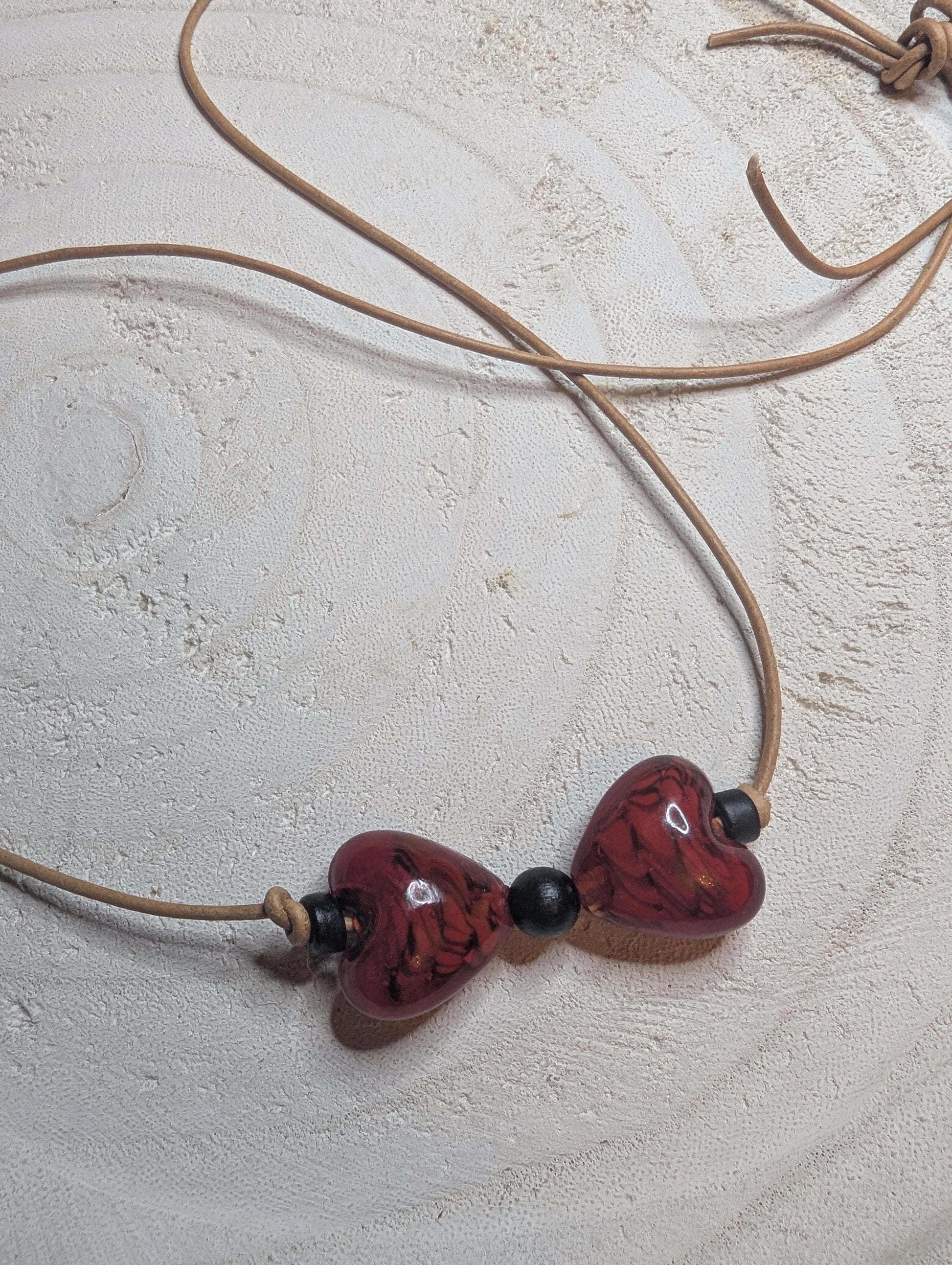Necklace with heart-shaped beads  from Sedona, AZ on a leather cord.