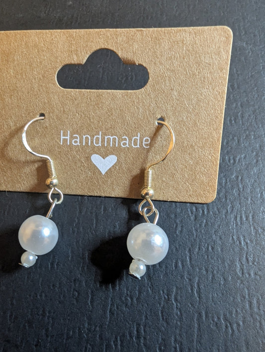 Pearl drop earrings with two pearls in a tiered design.