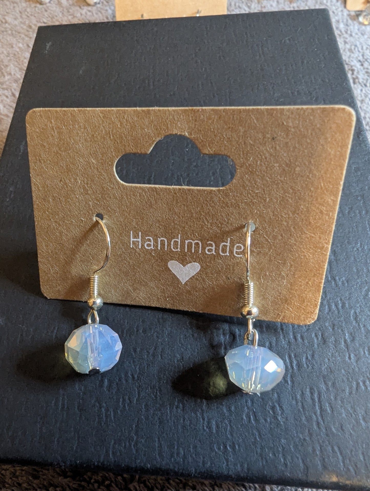 Sterling silver drop hoop earrings with iridescent glass beads