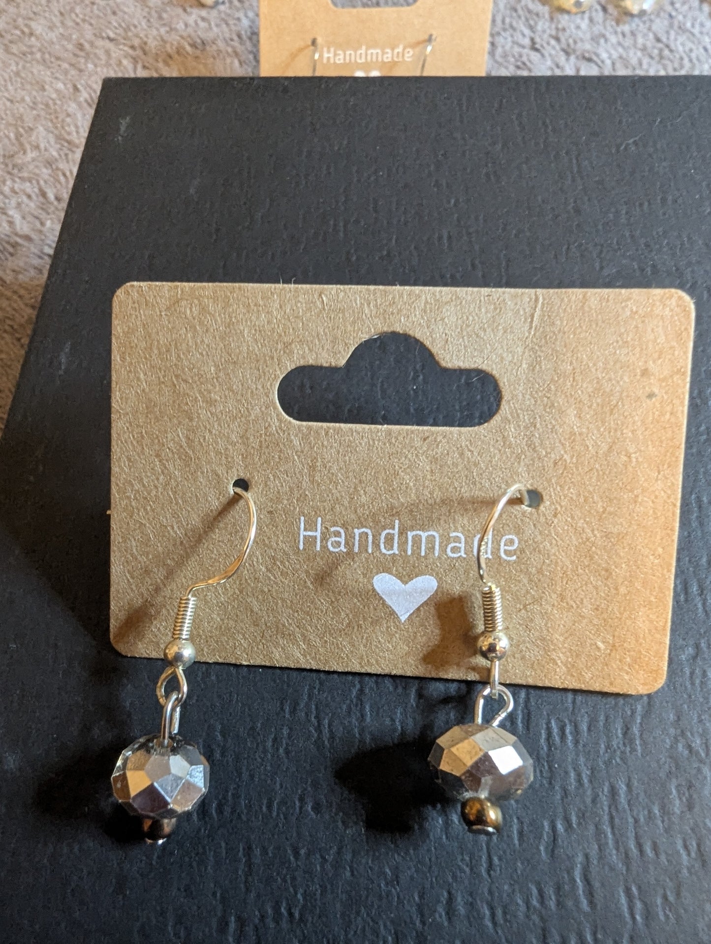 Drop earrings in silver mirrored color that are lightweight