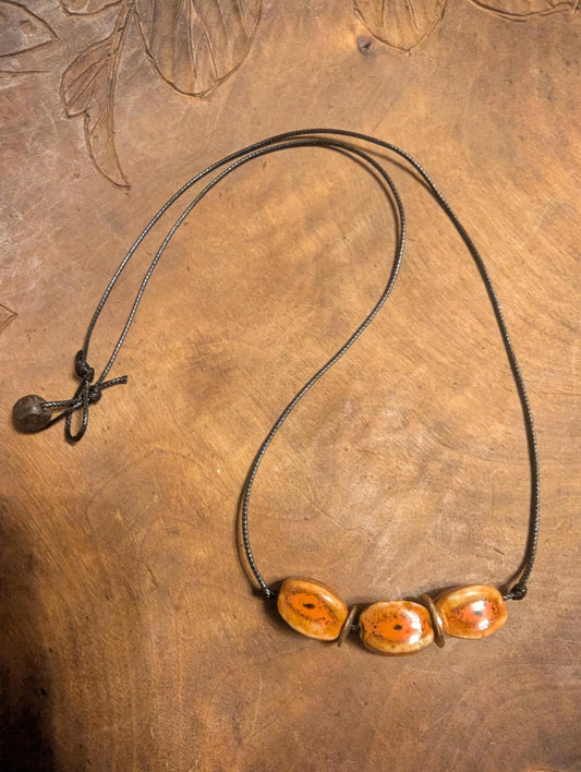 Louii collection Red and black oval ceramicbeaded  necklace. Beads directly from Sedona AZ!