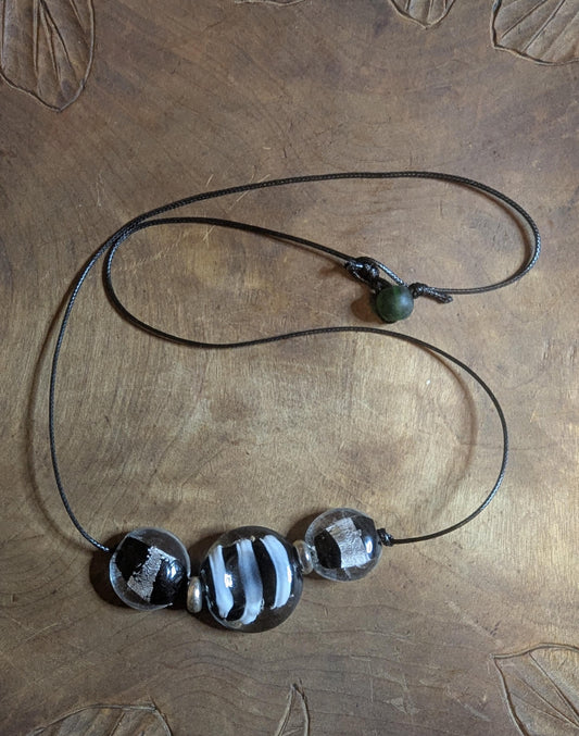 Black and white corded necklace.
